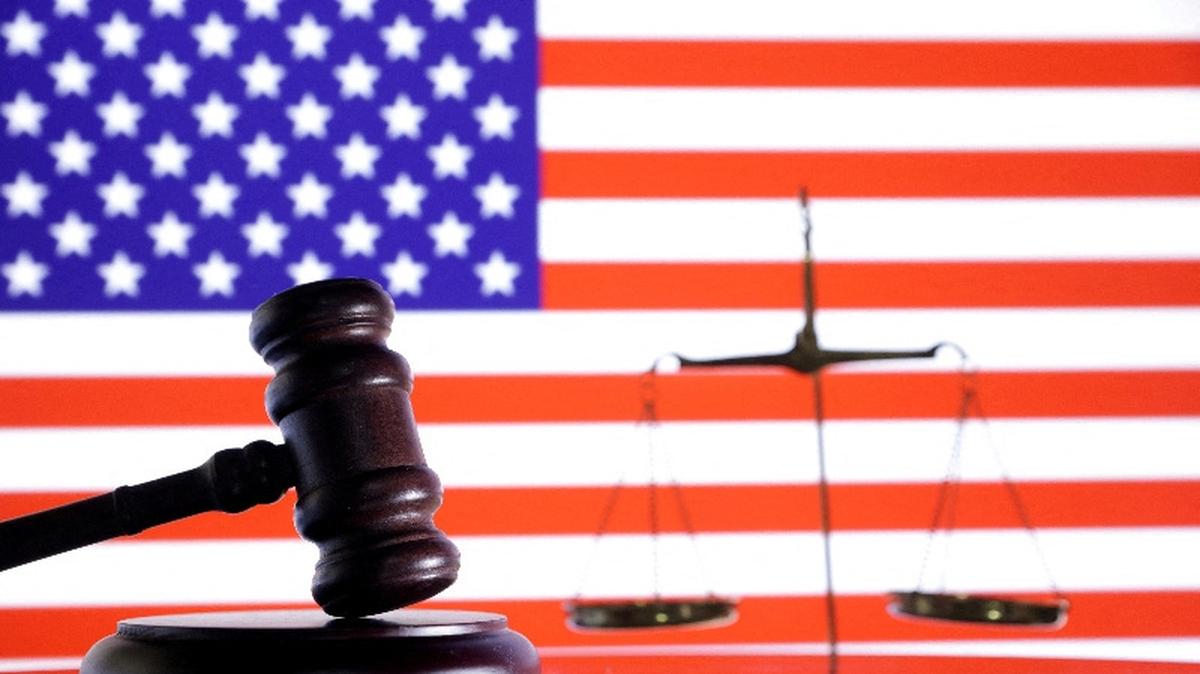 FILE PHOTO: The U.S. flag, a judge gavel and a vintage scale are seen in this illustration taken August 6, 2024. REUTERS/Dado Ruvic/Illustration/File Photo