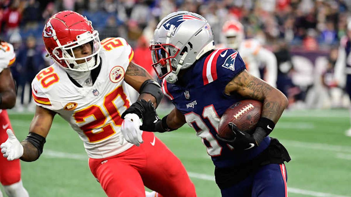  Dec 17, 2023; Foxborough, Massachusetts, USA; New England Patriots wide receiver Demario Douglas (81) runs the ball against Kansas City Chiefs safety Justin Reid (20) during the second half at Gillette Stadium. Mandatory Credit: Eric Canha-Imagn Images | Eric Canha-Imagn Images 