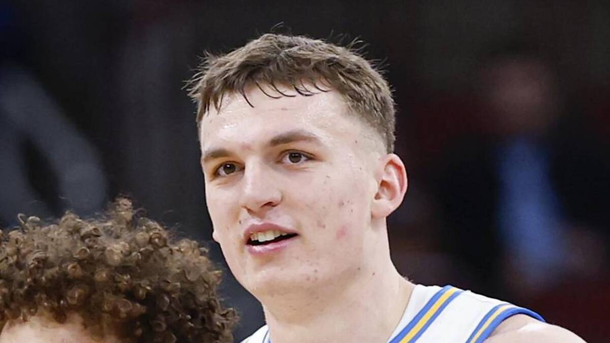  Mar 12, 2026; Chicago, IL, USA; UCLA Bruins guard Trent Perry (0) and forward Tyler Bilodeau (34) smile during the second half at United Center. Mandatory Credit: Kamil Krzaczynski-Imagn Images | Kamil Krzaczynski-Imagn Images 