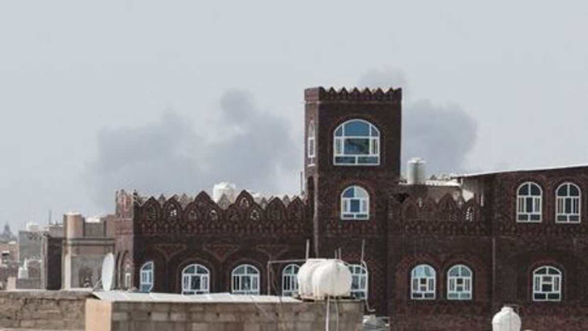 Smoke rises after an airstrike on the Sanaa International Airport, as seen from Sanaa, Yemen, on Monday. The Houthi militia blamed Saudi Arabia for the attack and fired missiles at the kingdom’s Abha international airport.