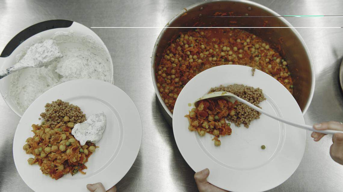 Students participate in a culinary medicine class at Community Servings, in Boston’s Jamaica Plain neighborhood, on March 26, 2026. The meals have healthy components like whole wheat couscous and yogurt sauce with cucumber and mint.