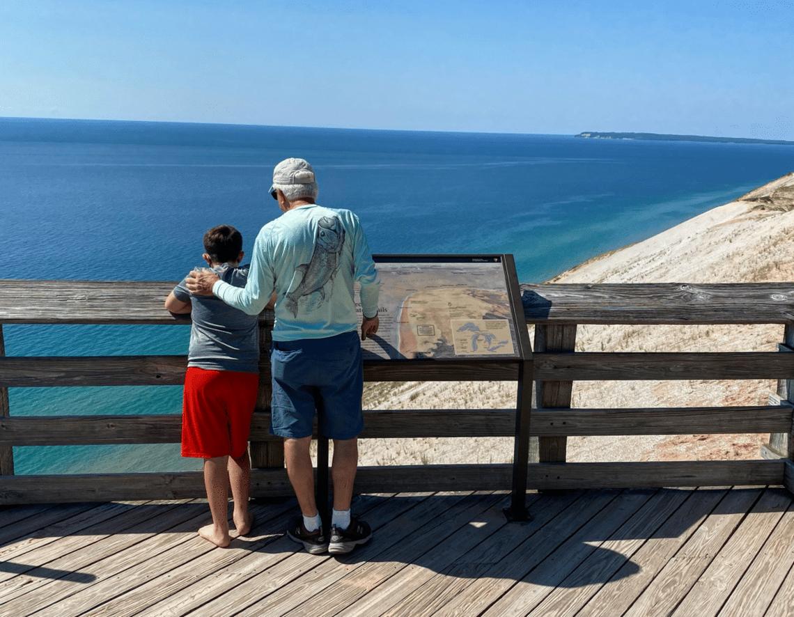  Grandpa and grandson at Sleeping Bear Dunes National Park, an Instagram-worthy family vacation with teens. Photo credit: Kristen Shaw 