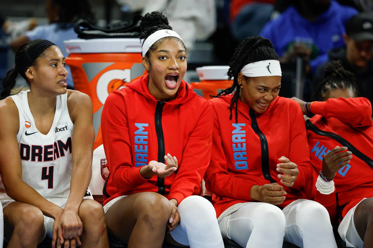  Apr 29, 2026; Chicago, IL, USA; Atlanta Dream forward Angel Reese (5) jokes with her teammates during the second half of a WNBA preseason game against the Chicago Sky at Wintrust Arena. Mandatory Credit: Kamil Krzaczynski-Imagn Images 