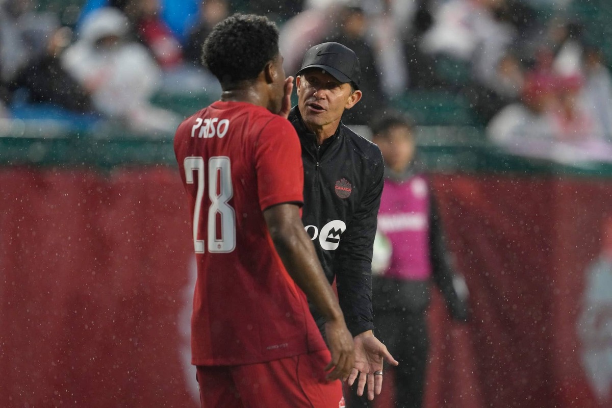 EDMONTON, ALBERTA - JUNE 01: Jesse Marsch head coach of Canada talks with  Ralph Priso-Mbongue during the international friendly match between Canada and Uzbekistan. (Photo by Jeff Vinnick/Getty Images)
