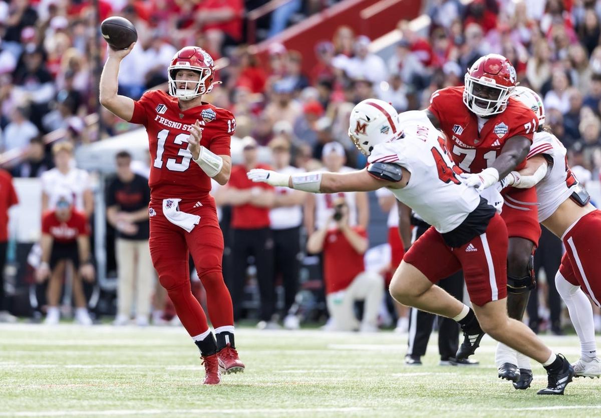 Fresno State quarterback E.J. Warner (13) led the Bulldogs to an 18-3 win against Miami-Ohio at the Snoop Dogg Arizona Bowl at Casino Del Sol Stadium.