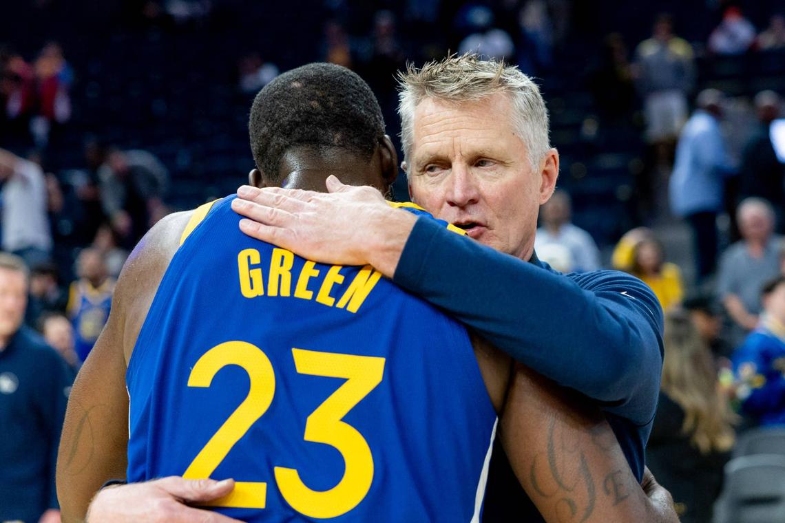  Golden State Warriors head coach Steve Kerr and Golden State Warriors forward Draymond Green (23) embrace after the game against the Chicago Bulls at Chase Center. Bob Kupbens-Imagn Images