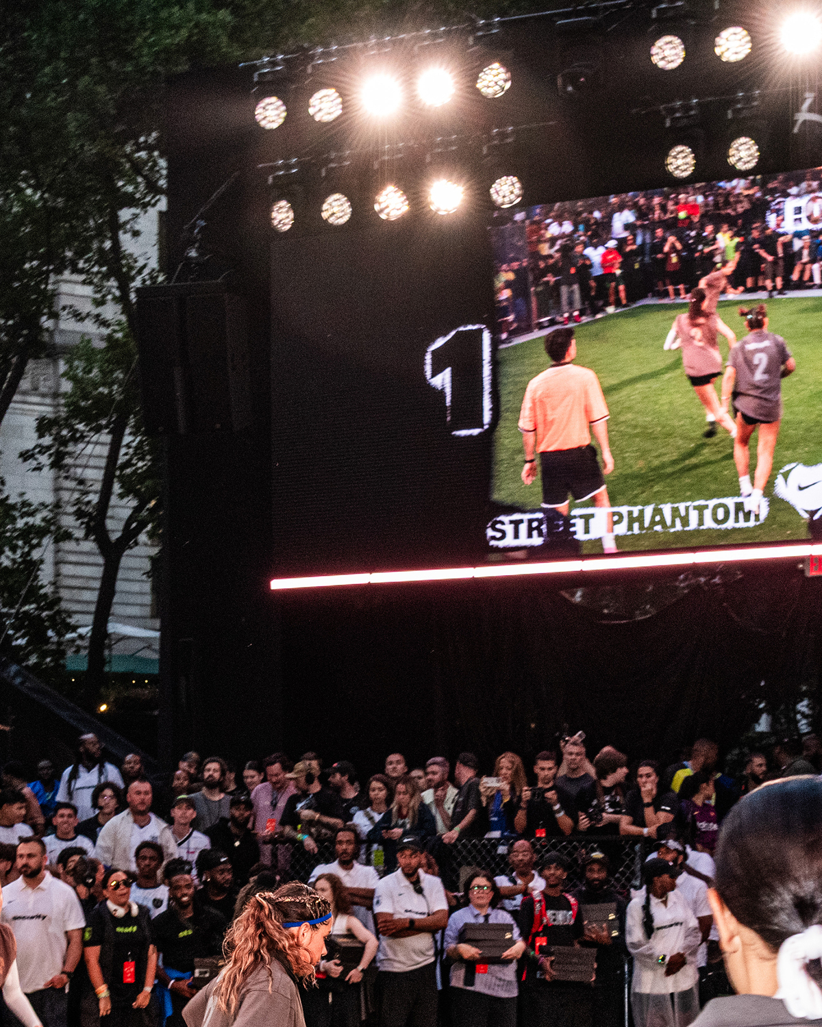 Street Phantom and FC Hooligans play in the girls final at a Nike Toma soccer event in New York on June 27, 2026. As World Cup matches take place across the United States, Nike and Adidas, the two largest sportswear companies in the world, are spending millions of dollars in a duel over the future of soccer in America. (Emma Rose Milligan/The New York Times)