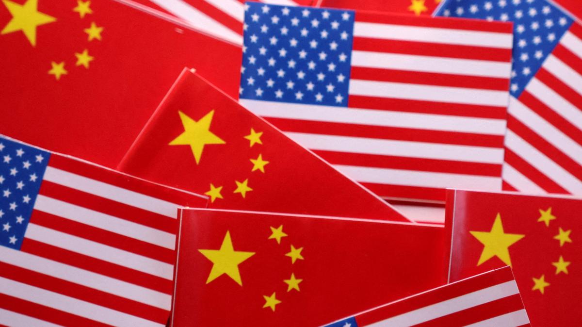 FILE PHOTO: U.S. and Chinese flags are seen in this illustration created on March 20, 2025. REUTERS/Dado Ruvic/Illustration/File Photo