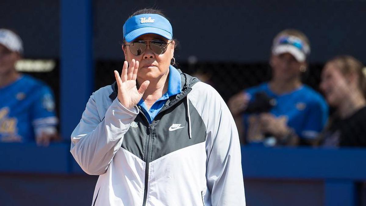  Jun 1, 2025; Oklahoma City, OK, USA; UCLA Bruins head coach Kelly Inouye-Perez holds her hand up in the sixth inning against the Tennessee Lady Volunteers during the NCAA Softball Women's College World Series at Devon Park. Mandatory Credit: Brett Rojo-Imagn Images | Brett Rojo-Imagn Images 