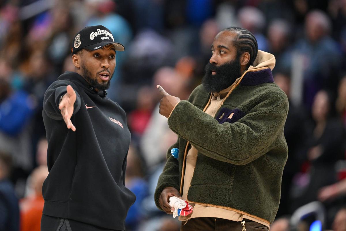  Cleveland Cavaliers guard Donovan Mitchell (left) talks with teammate James Harden during a timeout against the Detroit Pistons. Lon Horwedel-Imagn Images