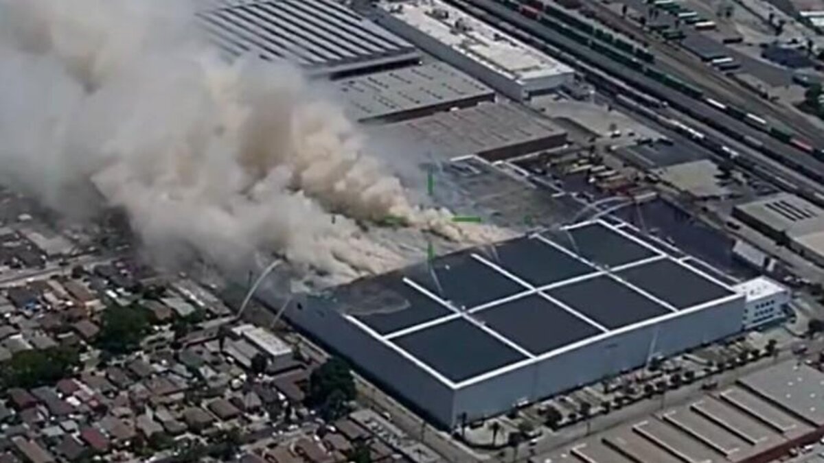 Drone video released Saturday showed plumes of smoke emanating from a warehouse east of downtown Los Angeles as firefighters battled the sprawling blaze for a third day.