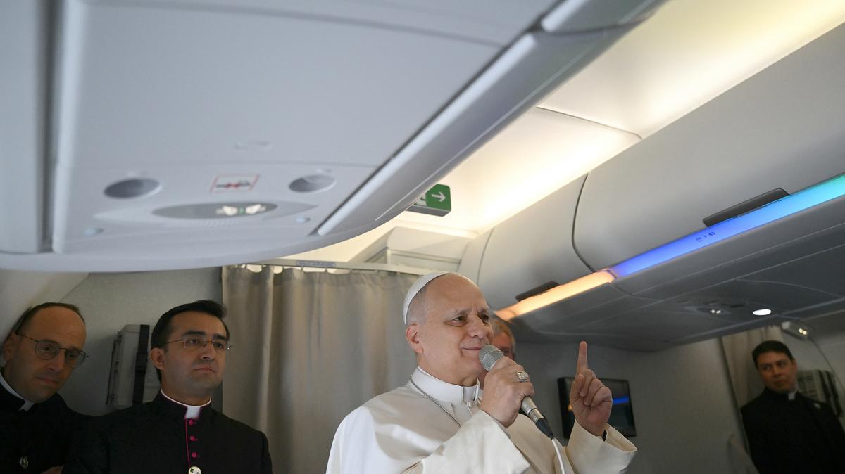 Pope Leo XIV addresses journalists during the flight heading to Algiers on April 13, 2026. Pope Leo XIV embarks today on an 11-day visit to Algeria, Cameroon, Angola and Equatorial Guinea for his first major international trip since becoming pontiff last year. (Alberto Pizzoli/Pool/AFP/Getty Images/TNS)