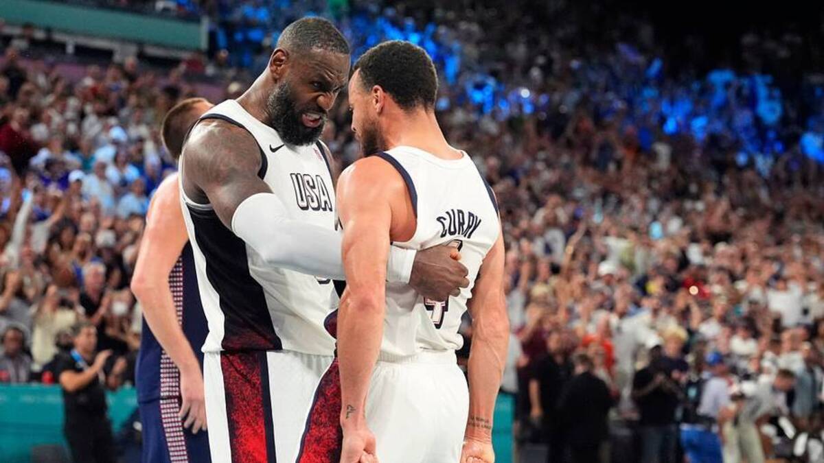  United States forward LeBron James and guard Stephen Curry celebrate after the game against Serbia in a men's basketball semifinal during the Paris 2024 Olympic Summer Games at Accor Arena on Aug. 8, 2024. | USA TODAY Network via Reuters Connect 