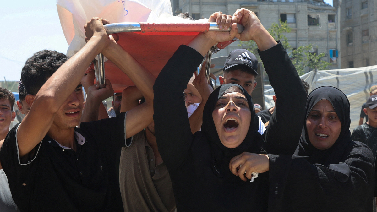 Mother of Palestinian child Muataz Abu Shaar, who was killed by Israeli fire, according to medics, and other mourners carry his body during his funeral  in Khan Younis, in the southern Gaza Strip, July 14, 2026. REUTERS/Ramadan Abed