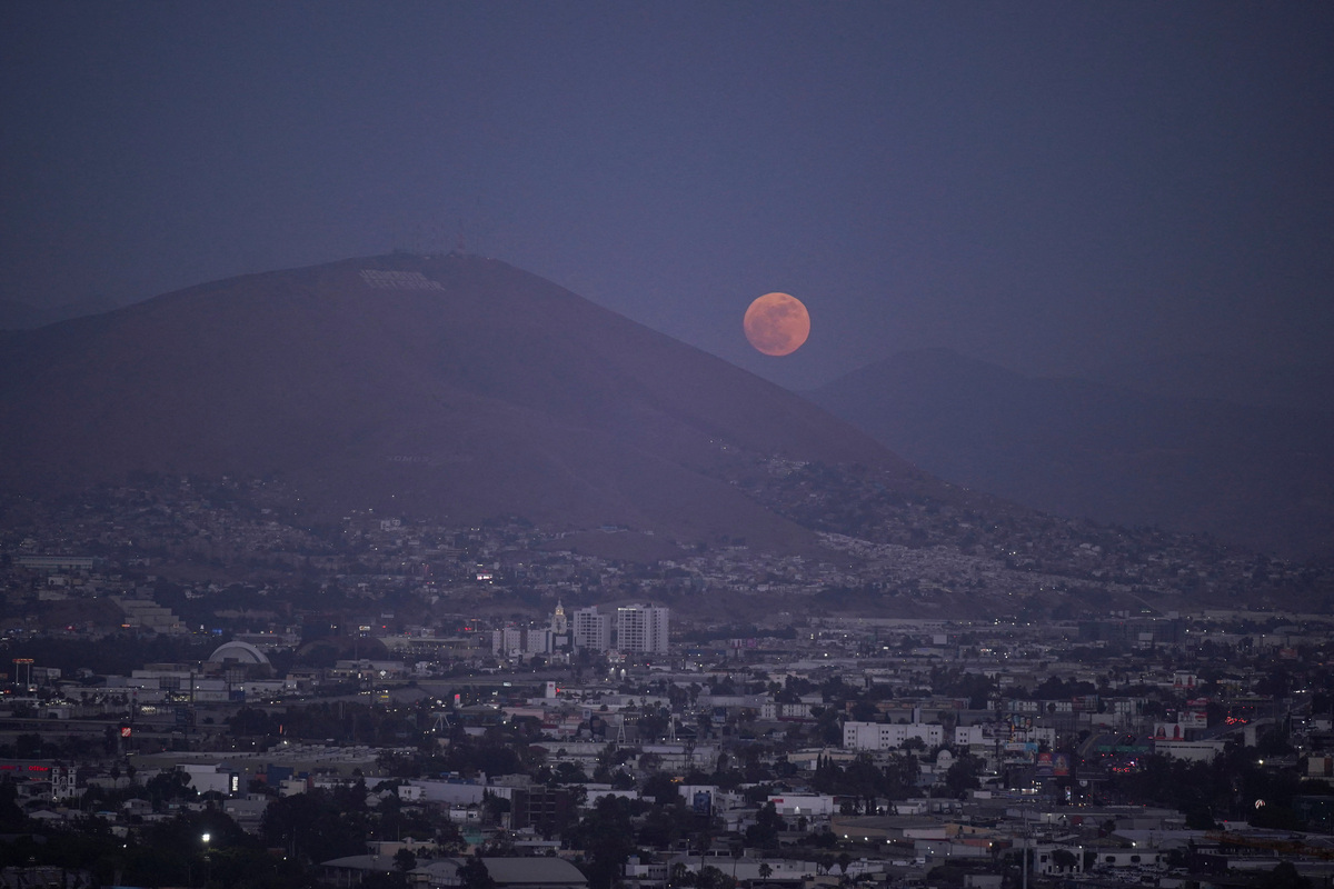The moon rises over Tijuana as the Iranian national soccer team is set to establish its base camp for the FIFA World Cup 2026 in the Mexican border city after Mexico’s President Claudia Sheinbaum agreed to host the squad, following reports that the U.S. government did not want Iran to remain at its original base in Arizona during the tournament, in Tijuana, Mexico, May 30, 2026. REUTERS/Victor Medina