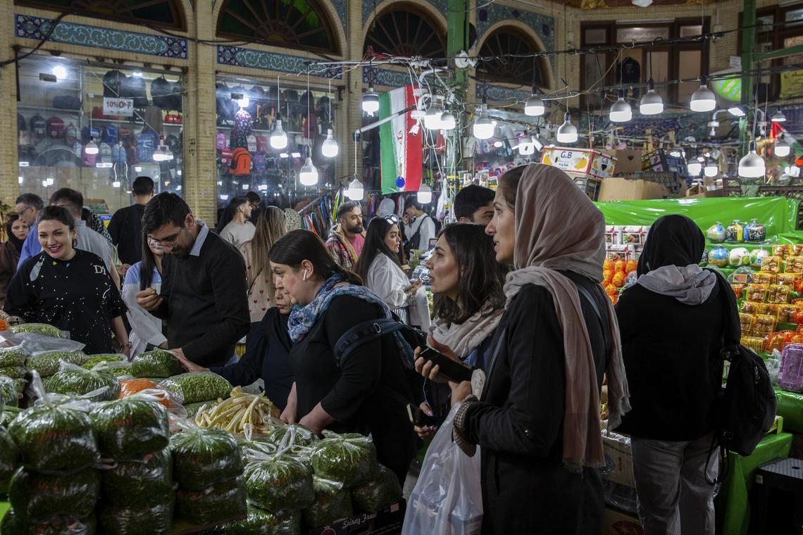 People shop for produce at the Tajrish Bazaar in Tehran, on Thursday, April 16, 2026. President Donald Trump told reporters at the White House that the next in-person negotiations with Iran might occur this weekend. (Arash Khamooshi/The New York Times)