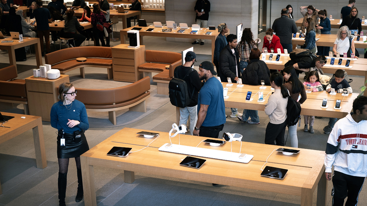 Customers shop electronics at an Apple store on April 14, 2025, in Chicago, Illinois. (Scott Olson/Getty Images/TNS)