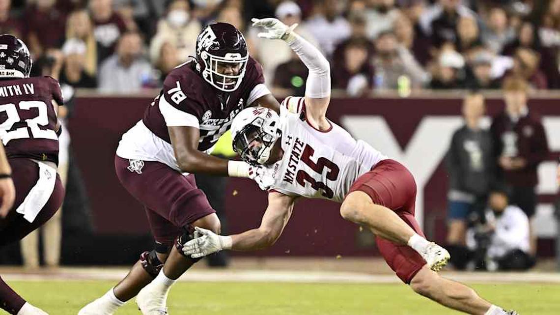 Nov 16, 2024; College Station, Texas, USA; New Mexico State Aggies linebacker Tyler Martinez (35) defends in coverage as Texas A&M Aggies offensive lineman Dametrious Crownover (78) blocks during the second half at Kyle Field. Mandatory Credit: Maria Lysaker-Imagn Images | Maria Lysaker-Imagn Images 