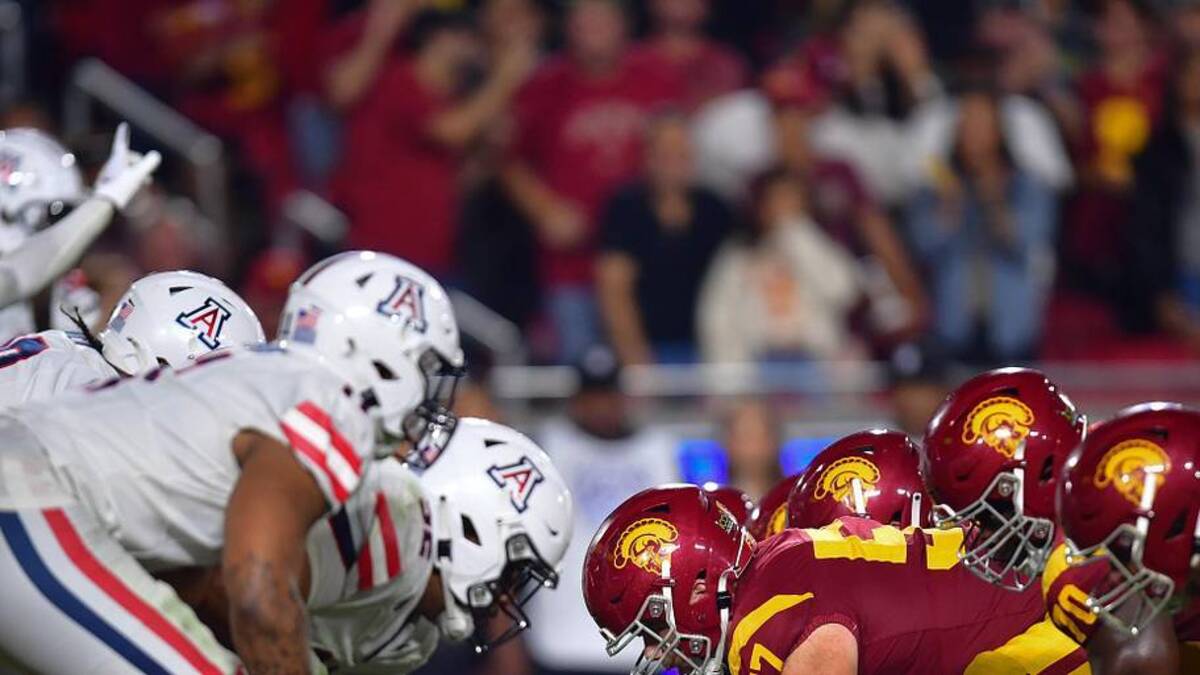  Oct 7, 2023; Los Angeles, California, USA; Southern California Trojans offensive lineman Justin Dedich (57) lines up against the Arizona Wildcats defense during the second half at Los Angeles Memorial Coliseum. Mandatory Credit: Gary A. Vasquez-Imagn Images | Gary A. Vasquez-Imagn Images 