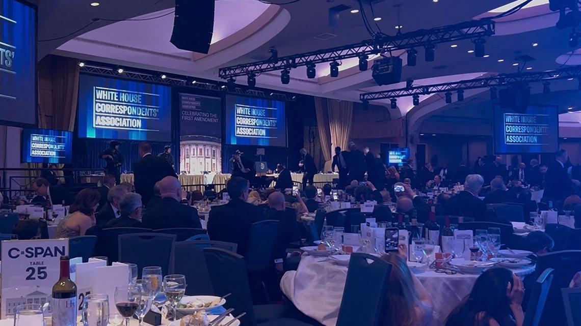 A screen grab taken from a video filmed by an AFP reporter shows armed agents moving to the stage after loud bangs were heard during the White House Correspondents' dinner at the Washington Hilton in Washington, D.C., on April 25, 2026.  (Danny Kemp and AFPTV teams/AFP/Getty Images/TNS)