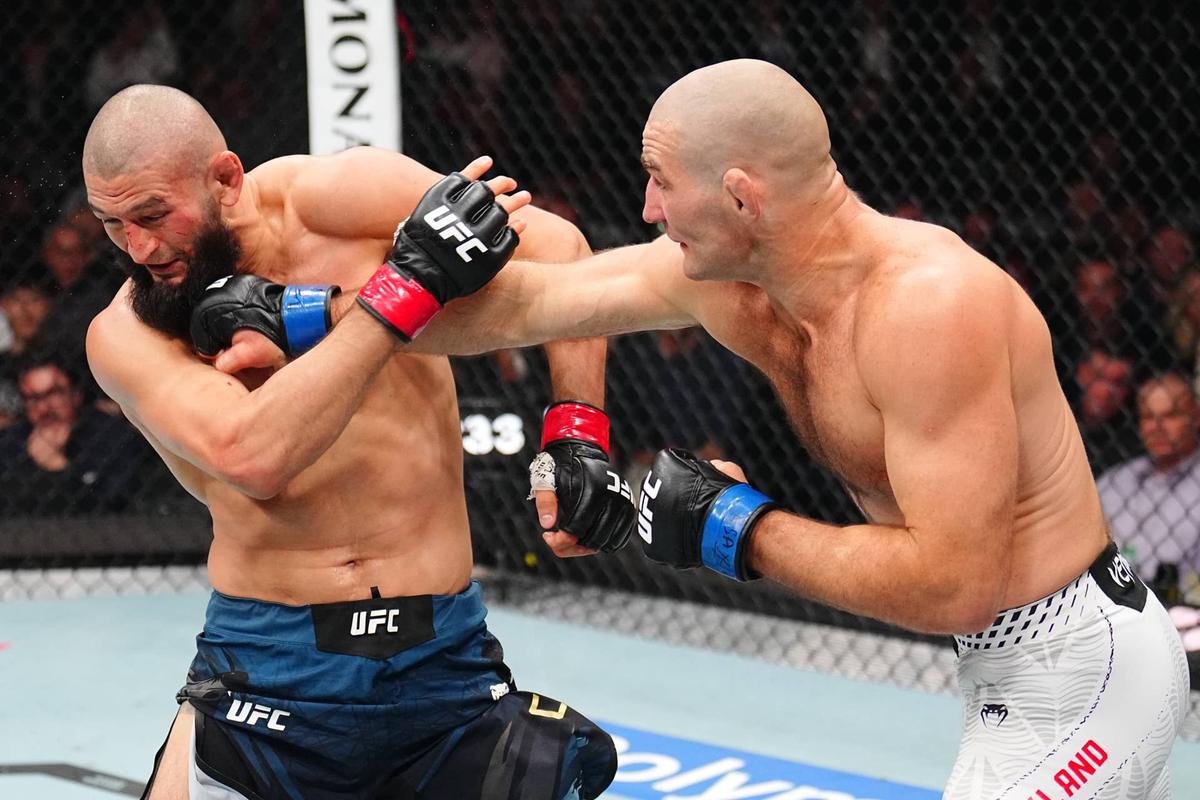  (R-L) Sean Strickland punches Khamzat Chimaev Chris Unger/Zuffa LLC-GettyImages