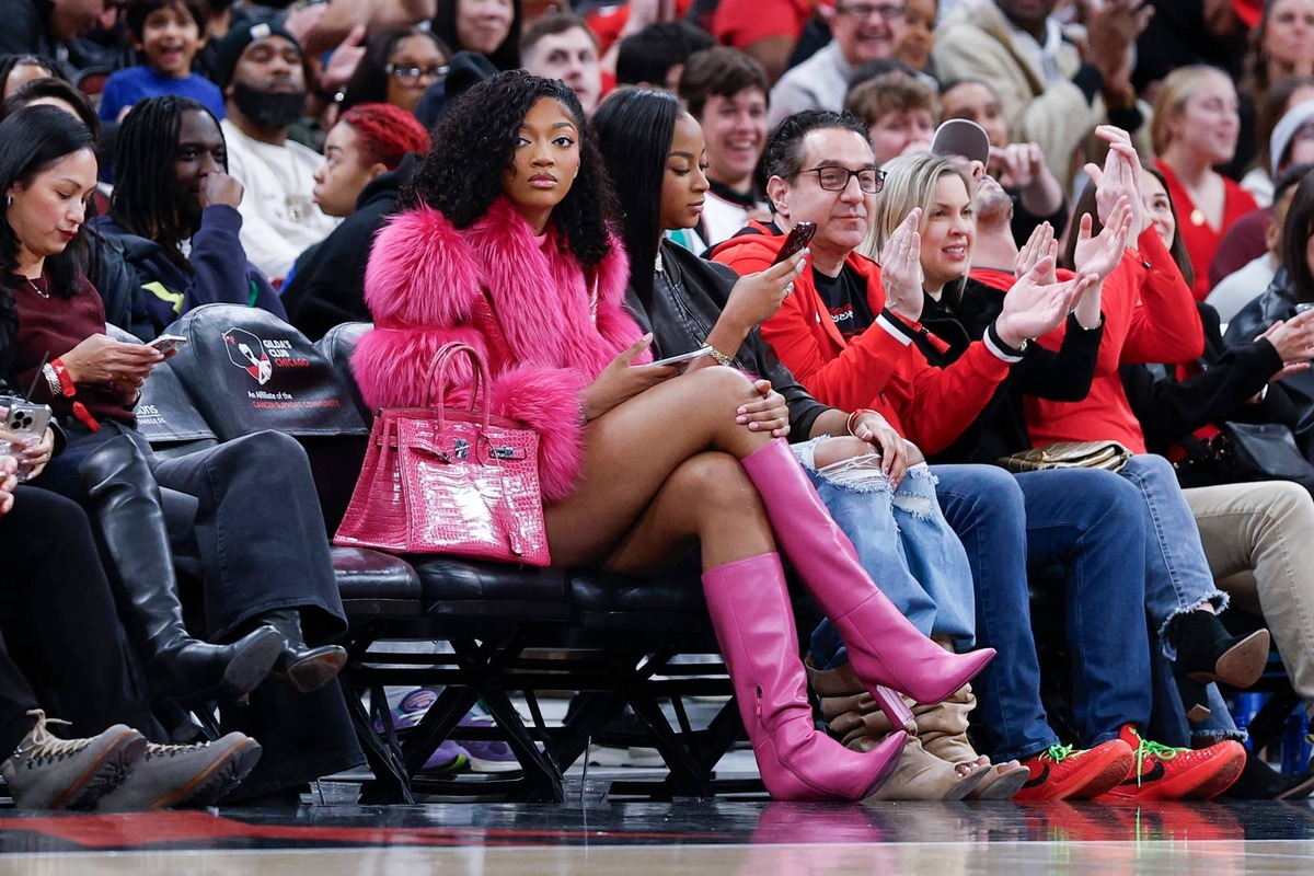  Angel Reese watches an NBA game between the Chicago Bulls and Orlando Magic. Kamil Krzaczynski-Imagn Images