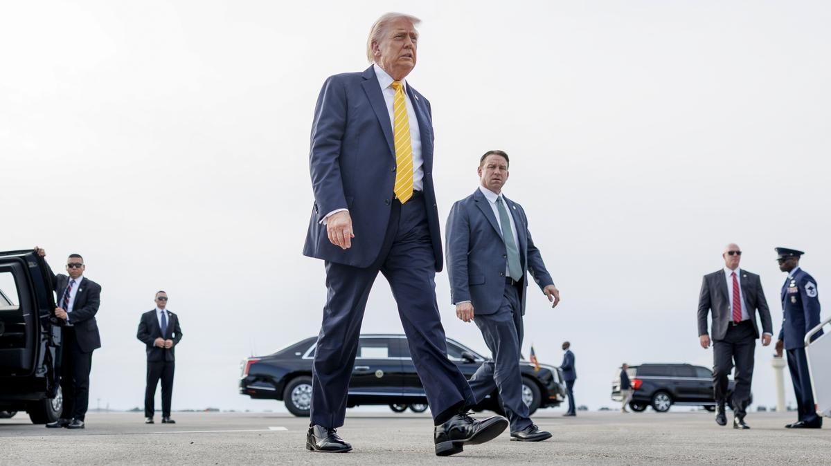 President Donald Trump walks to board Air Force One at Palm Beach International Airport in West Palm Beach, Fla., on Saturday. Trump's predictions of a relatively short-term conflict with minimal economic consequences appear to be crumbling.