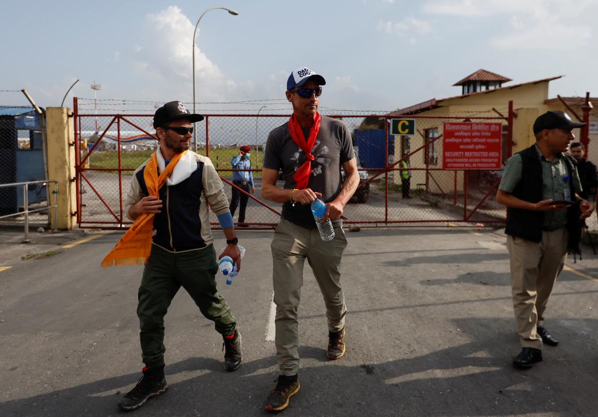 British climber Kenton Cool, 49, walks out from the airport as he returns after completing his 17th ascent of Mount Everest, which is the most by any foreign climber, in Kathmandu, Nepal May 19, 2023. REUTERS/Navesh Chitrakar