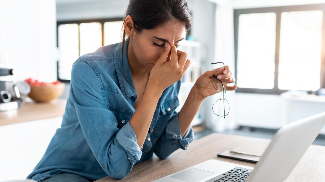Stressed woman sitting in front of computer. Stressed woman sitting in front of computer. Commenters on a viral TikTok were empathetic to one user who lamented over her struggle to leave the world of retail. 