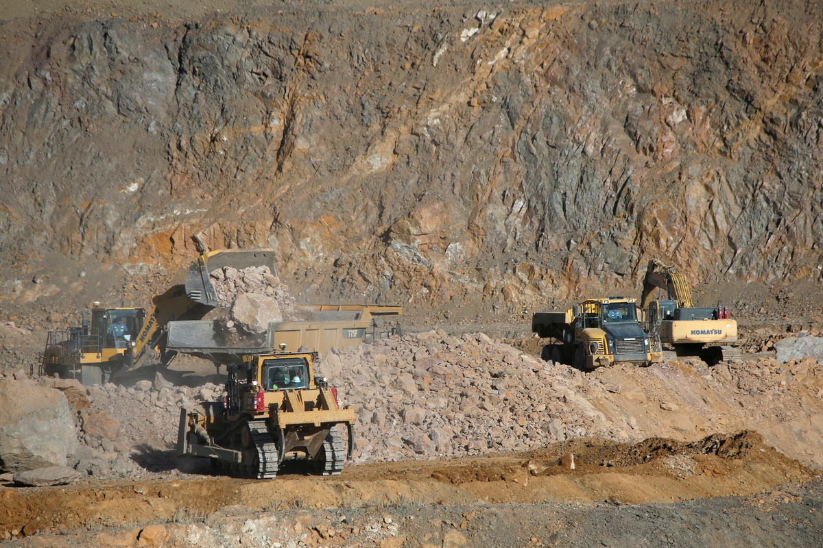 Wheel loaders fill trucks with ore at the MP Materials rare earth mine in Mountain Pass, California, U.S. January 30, 2020. Picture taken January 30, 2020. REUTERS/Steve Marcus