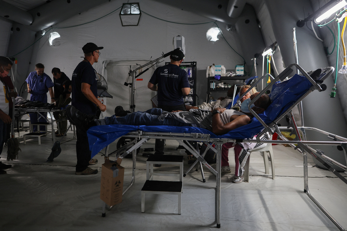 A man rests, as he receives treatment at a field hospital, which is part of the U.S. State Department's coordination, in the aftermath of the June 24 earthquakes, in La Guaira, Venezuela, July 4, 2026. REUTERS/Adriano Machado