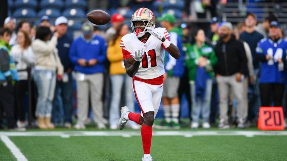  Oct 10, 2024; Seattle, Washington, USA; San Francisco 49ers wide receiver Brandon Aiyuk (11) catches the ball during warmups before the game against the Seattle Seahawks at Lumen Field. Mandatory Credit: Steven Bisig-Imagn Images | Steven Bisig-Imagn Images 