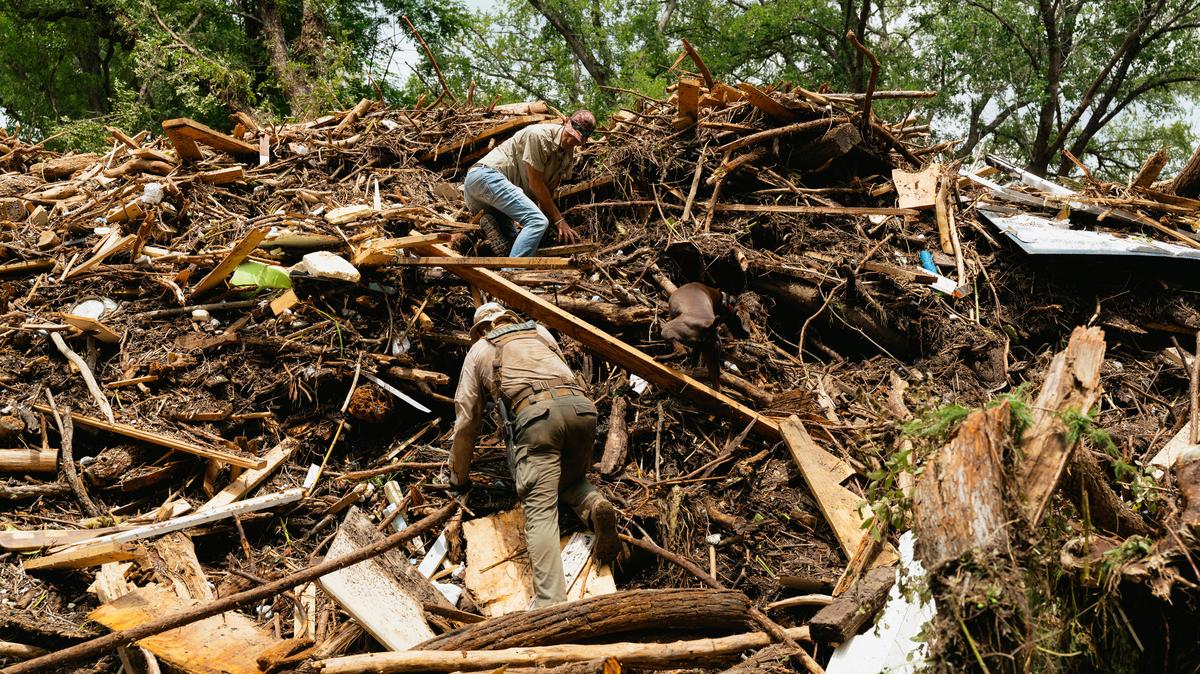 Authorities search for victims among the rubble near Blue Oak RV park after catastrophic flooding on the Guadalupe River in Kerrville, Texas, on Sunday, July 6, 2025. When catastrophic floodwaters surged through Kerr County last week, there were no sirens or early flooding monitors -- instead, there were text alerts that came late for some residents and were dismissed or unseen by others. (Jordan Vonderhaar/The New York Times)