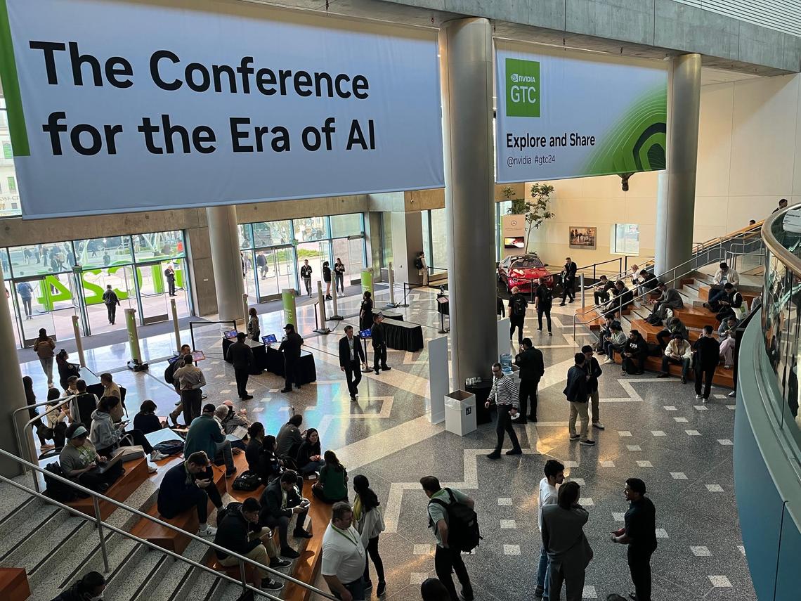 People attending the Nvidia GTC 2024 Conference in downtown San Jose gather inside the city’s Convention Center. The GTC gathering’s primary focus is artificial intelligence. (George Avalos/Bay Area News Group) Image capture: 3-18-2024, San Jose CA