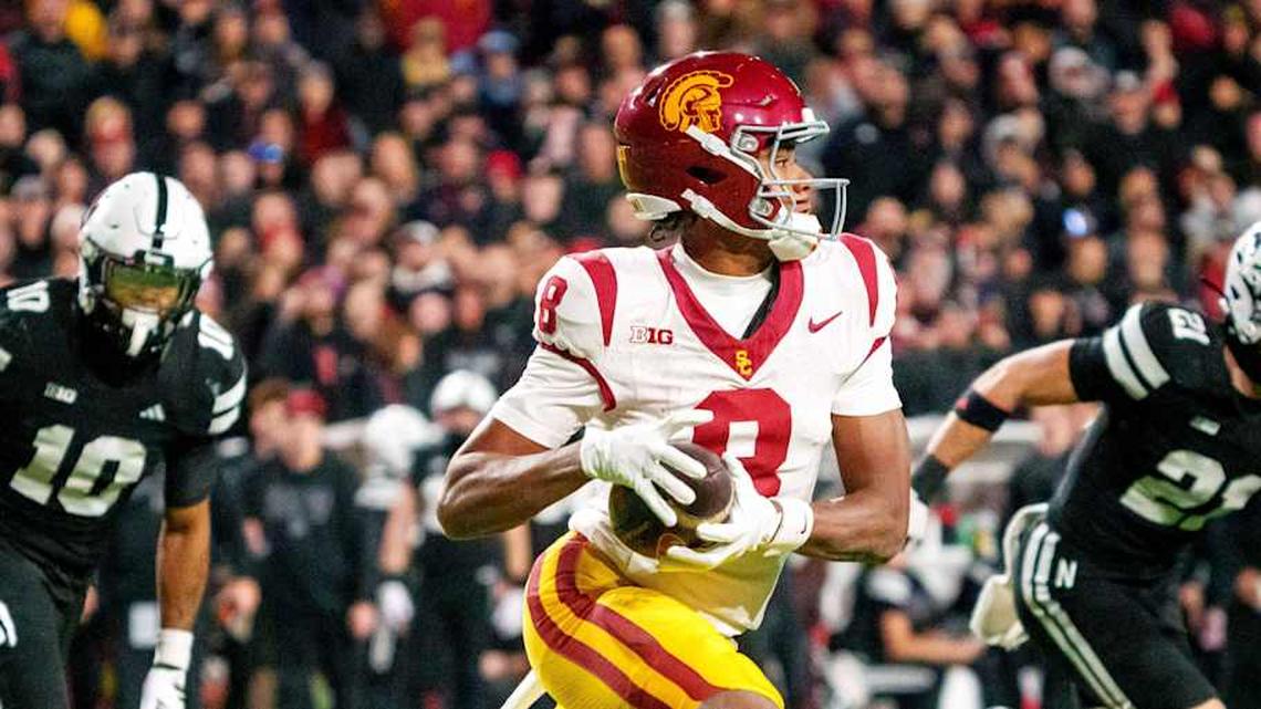  Nov 1, 2025; Lincoln, Nebraska, USA; Southern California Trojans wide receiver Ja'Kobi Lane (8) runs against Nebraska Cornhuskers defensive back Andrew Marshall (10) and defensive back Rex Guthrie (21) during the second quarter at Memorial Stadium. Mandatory Credit: Dylan Widger-Imagn Images | Dylan Widger-Imagn Images 