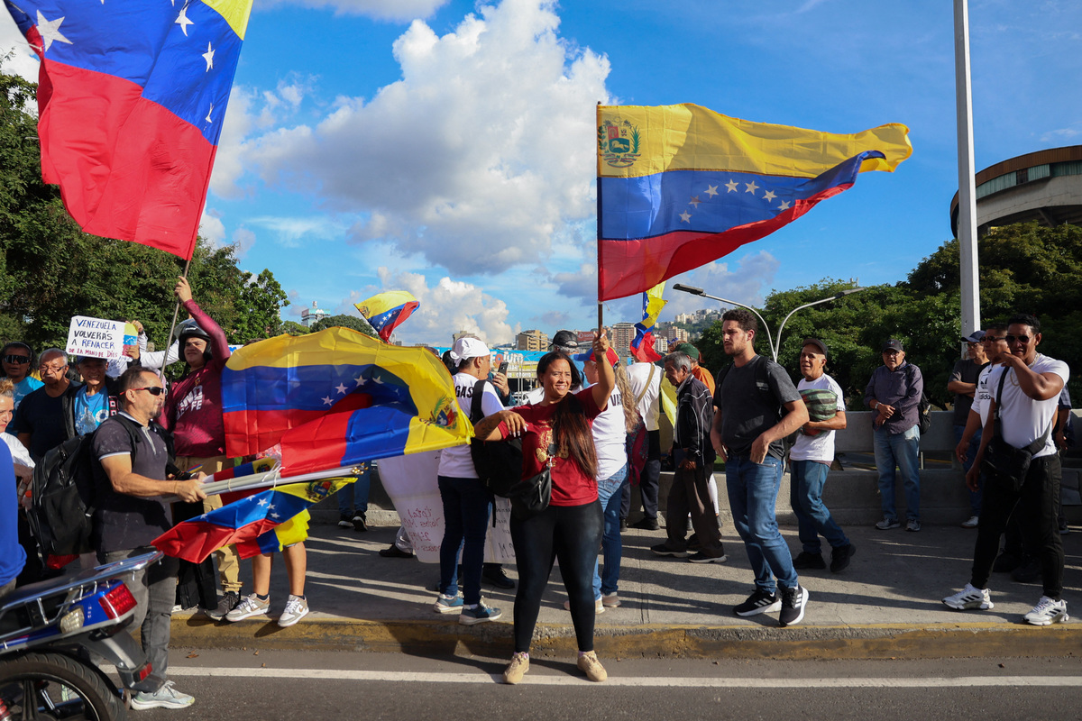 Venezuelans call for elections in first national protest in nearly two ...