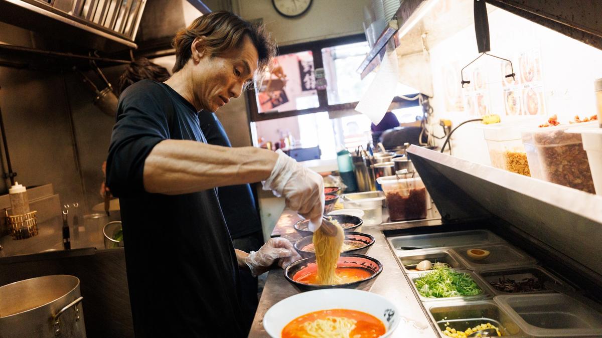 Restaurant owner Sato Asakura prepares bowls of ramen at Nozaru Ramen Bar in the Normal Heights neighborhood on Wednesday, May 20, 2026.  (Kristian Carreon / The San Diego Union-Tribune)