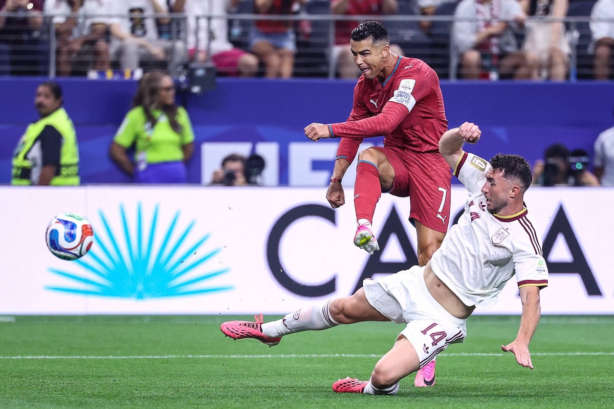  TOPSHOT - Portugal's forward #07 Cristiano Ronaldo kicks the ball and misses a chance past Spain's defender #14 Aymeric Laporte during the 2026 World Cup round of 16 football match between Portugal and Spain at the Dallas Stadium in Arlington on July 6, 2026. (Photo by Thomas COEX / AFP via Getty Images) Photo by Thomas COEX / AFP via Getty Images