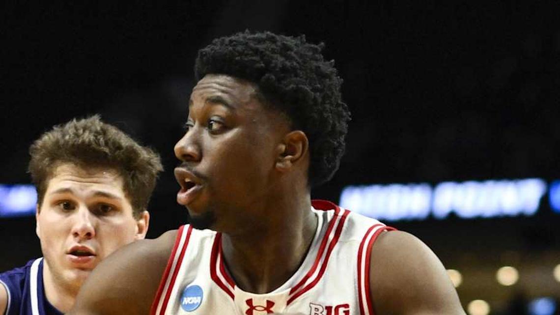  Mar 19, 2026; Portland, OR, USA; Wisconsin Badgers guard John Blackwell (25) drives to the basket against High Point Panthers guard Chase Johnston (99) during the second half of a first round game of the men's 2026 NCAA Tournament at Moda Center. Mandatory Credit: Troy Wayrynen-Imagn Images | Troy Wayrynen-Imagn Images 
