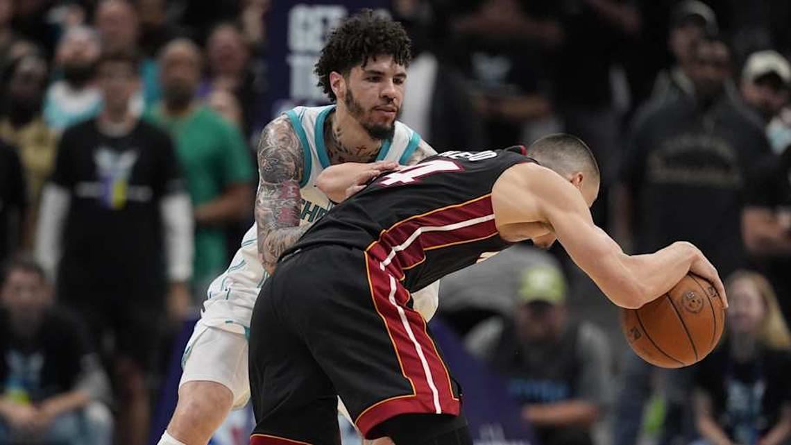  Apr 14, 2026; Charlotte, North Carolina, USA; Charlotte Hornets guard LaMelo Ball (1) defends against Miami Heat guard Tyler Herro (14) during the second half during the play-in rounds between the Charlotte Hornets and the Miami Heat of the 2026 NBA Playoffs at Spectrum Center. Mandatory Credit: Jim Dedmon-Imagn Images | Jim Dedmon-Imagn Images 