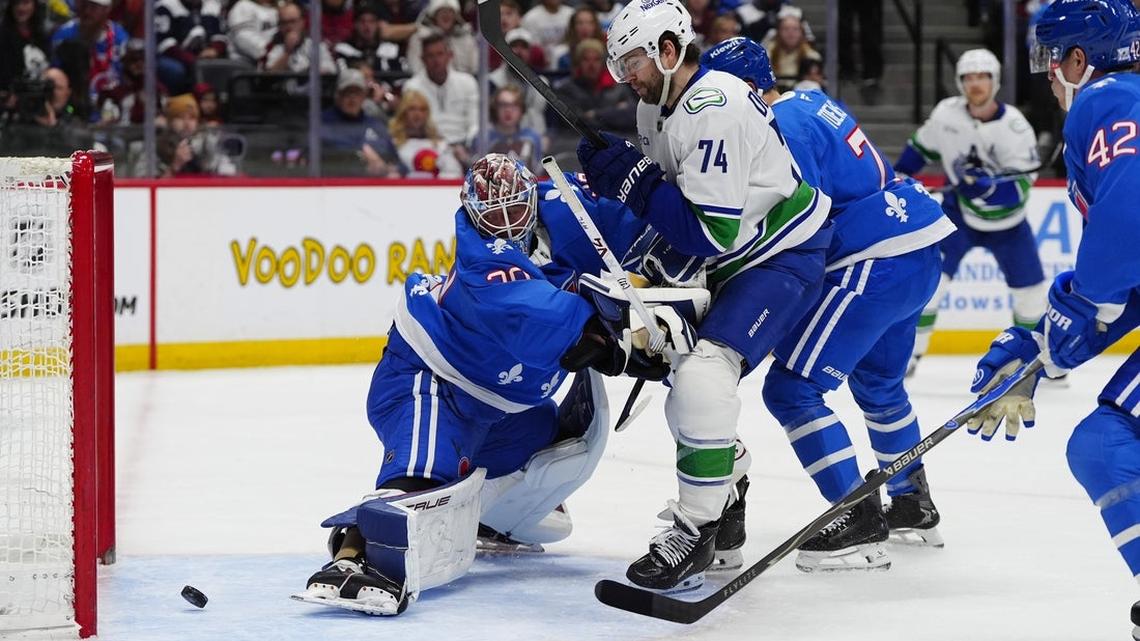 NHL-worst Canucks stun league-best Avalanche 8-6 