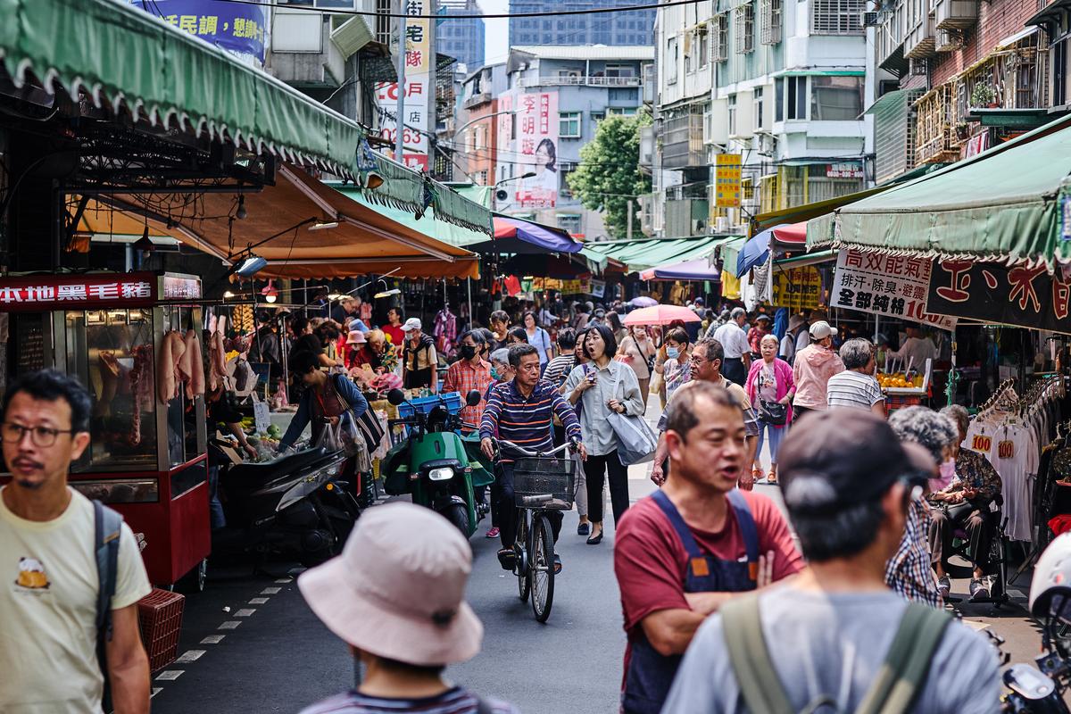 People shop the Xizhou Public Market in Taipei, Taiwan on April 9, 2026. Plastic producers in Taiwan have scrambled to secure new supplies since the war in Iran disrupted petrochemical flows and tightened availability. (An Rong Xu/The New York Times)