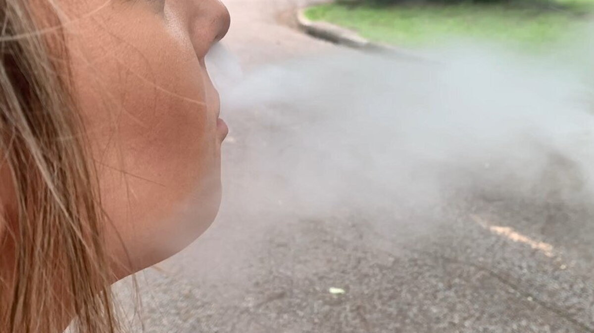 A woman blowing e-cigarette smoke. (American Heart Association via SWNS). 