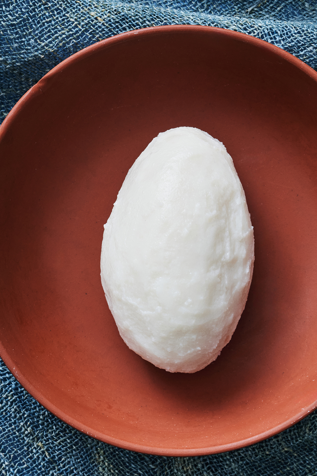 The dough transforms into something glossy and stretchy after minutes of folding. A versatile sidekick to soups and stews, swallows are full of possibility. That's what should keep you coming back, Yewande Komolafe writes. Food Stylist: Roscoe Betsill. Prop Stylist: Paige Hicks. (Kelly Marshall/The New York Times)
