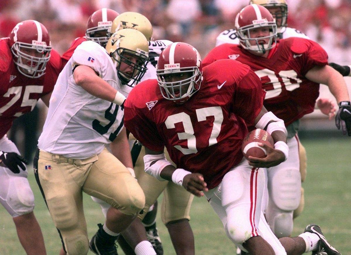  Alabama's Shaun Alexander runs for one of his three touchdowns against Vanderbilt at Legion Field. Imagn Images