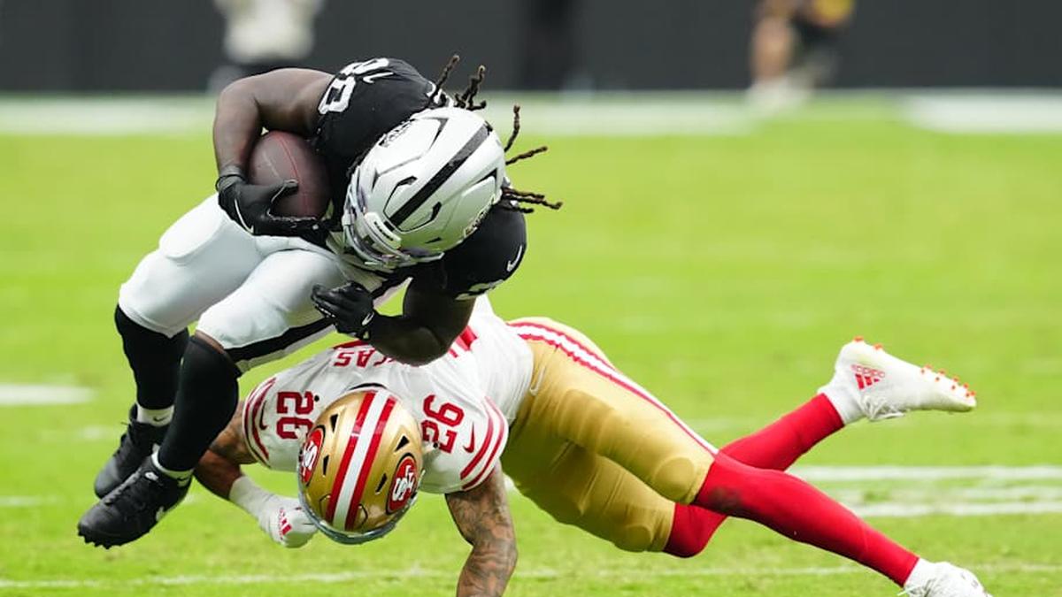  Aug 16, 2025; Paradise, Nevada, USA; Las Vegas Raiders running back Sincere McCormick (28) is tackled by San Francisco 49ers cornerback Chase Lucas (26) during the third quarter at Allegiant Stadium. Mandatory Credit: Stephen R. Sylvanie-Imagn Images | Stephen R. Sylvanie-Imagn Images 