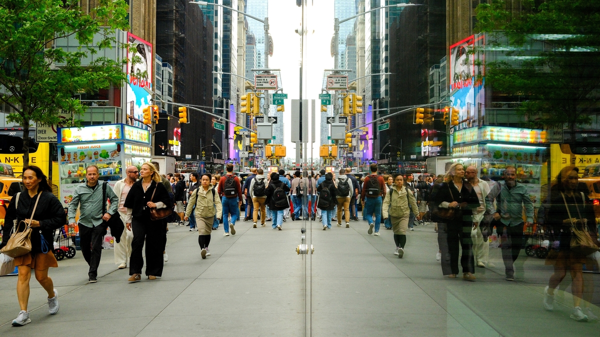 Pedestrians in New York City. Pedestrians and cars are reflected in a window as they move along Sixth Avenue and 42nd Street in the Manhattan borough of New York City on May 13, 2026. Image for illustration purposes only.