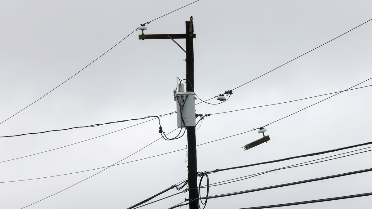 A damaged power line is seen during Tropical Storm Henri in Montauk, New York, U.S., August 22, 2021. REUTERS/Caitlin Ochs