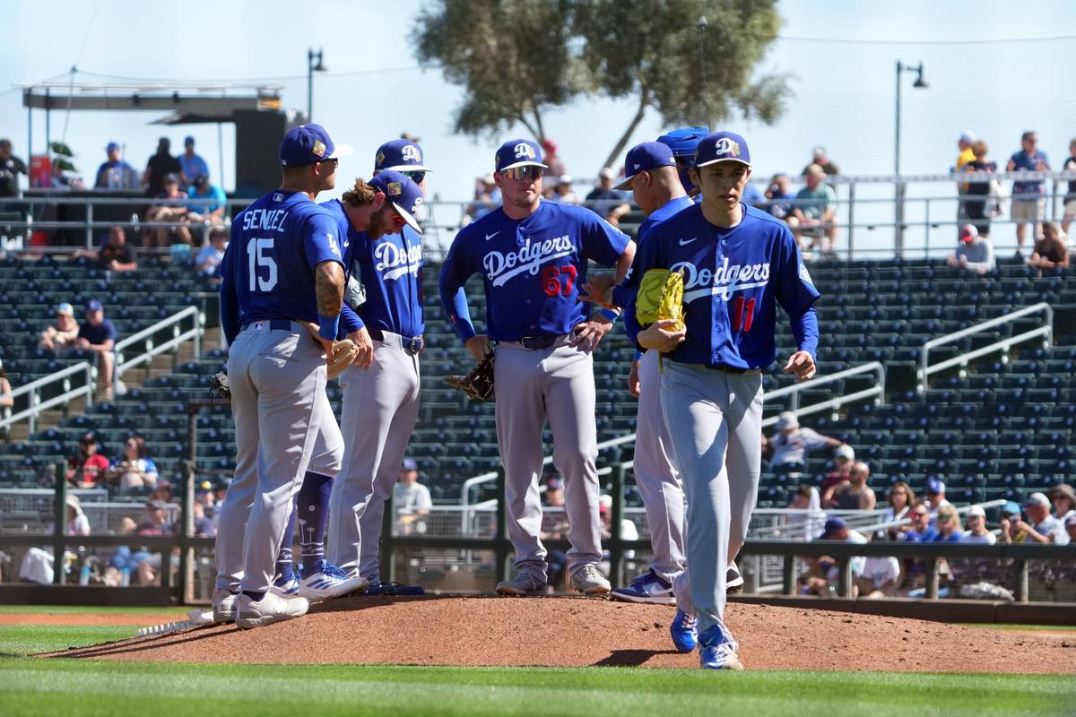  Los Angeles Dodgers starting pitcher Roki Sasaki (11) is taken out f the game by manager Dave Roberts (30) 