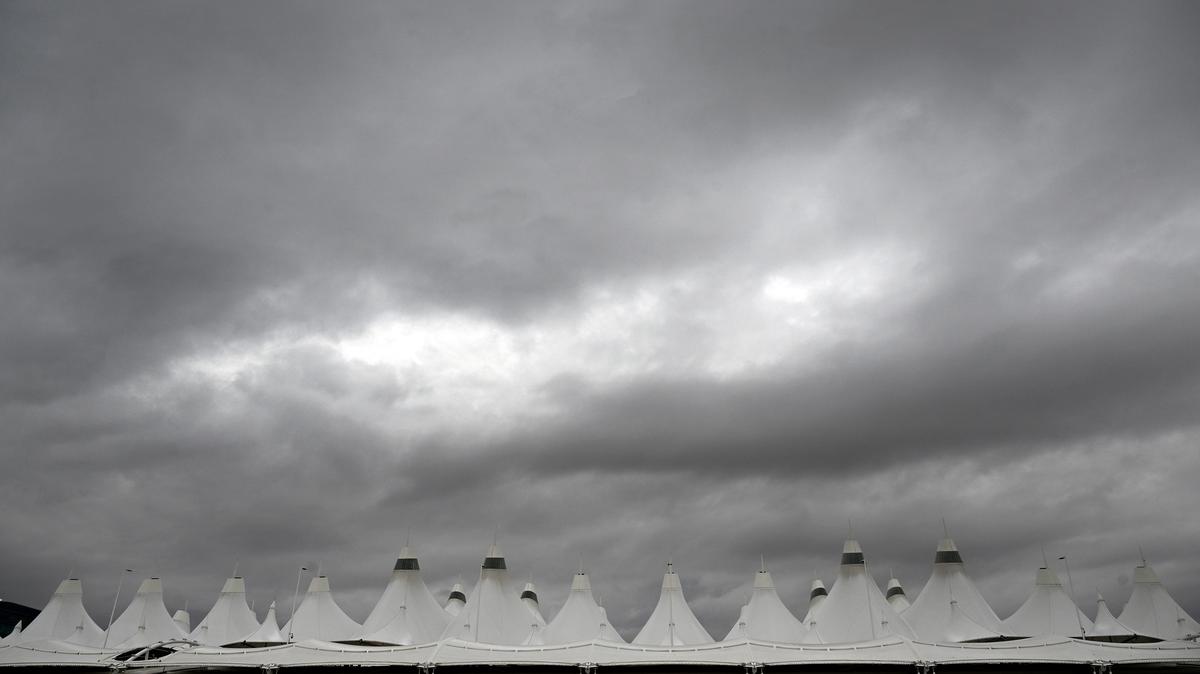Storm clouds gather above the iconic tents of Denver International Airport from the incoming snow storm at Denver International Airport in Denver on March 13, 2024. (Helen H. Richardson/The Denver Post/TNS)